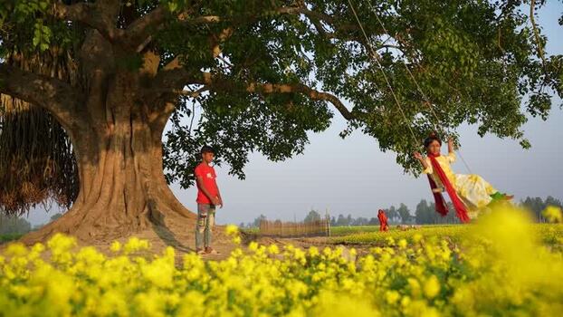 View of children playing under a banyan tree Bangladesh. View of children playing under a banyan tree Bangladesh.