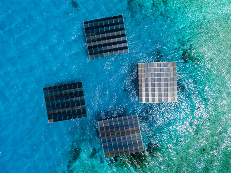 Aerial view of SolarSea floating solar power plant by Swimsol with four platforms on turquoise water in Dharavandhoo Baa Atoll Maldives. Aerial view of SolarSea floating solar power plant by Swimsol with four platforms on turquoise water in Dharavandhoo Baa Atoll Maldives.