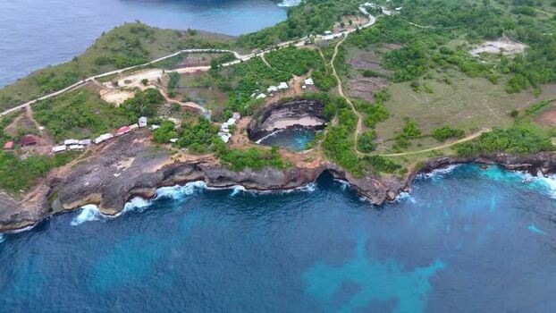 Aerial view of Broken Beach and rocky cliffs in Nusa Penida Indonesia.