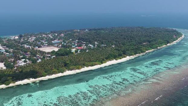 Aerial view of Vaikaradhoo island in the Maldives. Aerial view of Vaikaradhoo island in the Maldives.