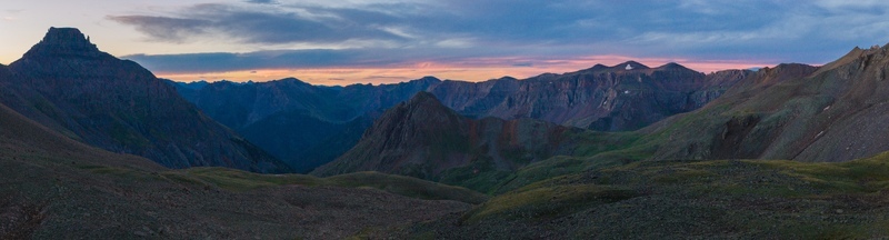 Aerial view of Mount Sneffels and the rugged peaks of the San Juan Mountains in the Rocky Mountains at dusk featuring rocky slopes and alpine terrain in Ouray County Colorado United States. Aerial view of Mount Sneffels and the rugged peaks of the San Juan Mountains in the Rocky Mountains at dusk featuring rocky slopes and alpine terrain in Ouray County Colorado United States.