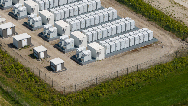 Wanneperveen Netherlands 23 May 2026 Aerial view of rows of white battery storage units and electrical infrastructure within a fenced facility surrounded by green fields. Wanneperveen Netherlands 23 May 2026 Aerial view of rows of white battery storage units and electrical infrastructure within a fenced facility surrounded by green fields.