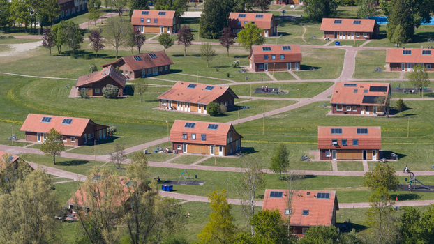 Drone view of AZC Luttelgeest in the Netherlands showing a reception centre for asylum seekers temporary housing community facilities and social infrastructure. Drone view of AZC Luttelgeest in the Netherlands showing a reception centre for asylum seekers temporary housing community facilities and social infrastructure.