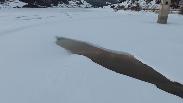 Aerial view of the submerged bell tower in Graun im Vinschgau Italy. Aerial view of the submerged bell tower in Graun im Vinschgau Italy.