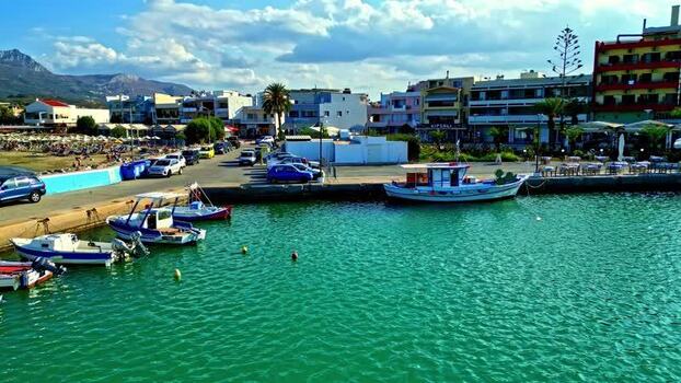 Aerial view of fishing boats in a harbor in Crete Greece.