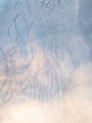 Aerial view of Reykjanes geothermal mineral terraces with intricate patterns and soft light in Grindavikurbaer Iceland. Aerial view of Reykjanes geothermal mineral terraces with intricate patterns and soft light in Grindavikurbaer Iceland.