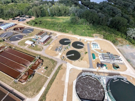 Aerial view of Broadholme water recycling centre with circular sedimentation tanks aeration basins and industrial infrastructure in Rushden England United Kingdom. Aerial view of Broadholme water recycling centre with circular sedimentation tanks aeration basins and industrial infrastructure in Rushden England United Kingdom.
