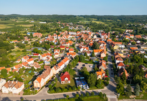 Aerial view of the town of Tolkmicko with historic red roofed buildings narrow streets and surrounding green fields in Tolkmicko Warmian Masurian Voivodeship Poland.