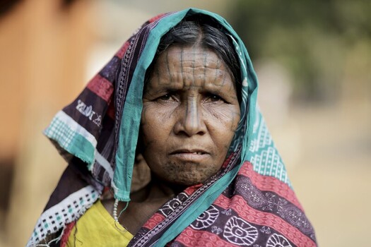 Odisha India 26 March 2026 View of a woman s face adorned with traditional tattoos under a vibrant headscarf a testament to cultural heritage. Odisha India 26 March 2026 View of a woman s face adorned with traditional tattoos under a vibrant headscarf a testament to cultural heritage.