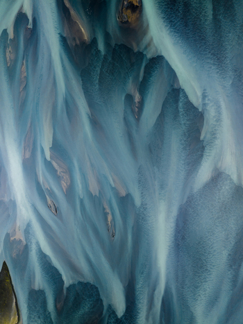 Aerial view of glacial rivers weaving a mesmerizing tapestry of silver and turquoise across the stark landscape Iceland Iceland. Aerial view of glacial rivers weaving a mesmerizing tapestry of silver and turquoise across the stark landscape Iceland Iceland.
