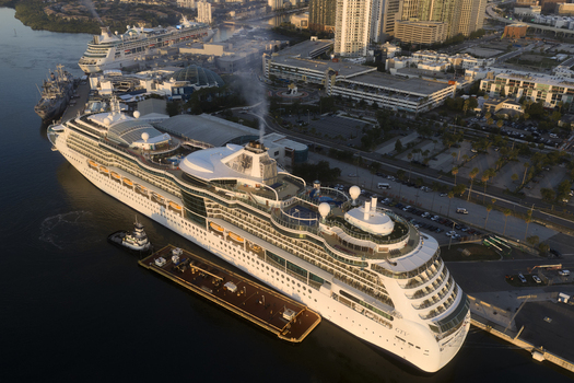 Tampa United States 04 July 2026 Aerial view of Tampa Cruise Terminal 6 with a large cruise ship docked at the pier surrounded by urban infrastructure and buildings in Tampa Florida.
