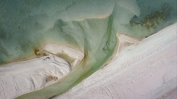 Aerial view of the turquoise blue water and intricate sand patterns along the coastline of Denham Western Australia Australia. Aerial view of the turquoise blue water and intricate sand patterns along the coastline of Denham Western Australia Australia.