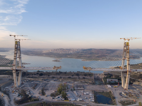 Aerial view of the Yavuz Sultan Selim Bridge under construction featuring tall concrete pylons steel cables and the Bosphorus strait in the background Istanbul Istanbul Turkiye.