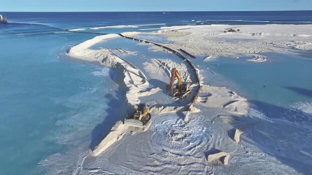 Aerial view of land reclamation with excavators on Gulhi Maldives. Aerial view of land reclamation with excavators on Gulhi Maldives.