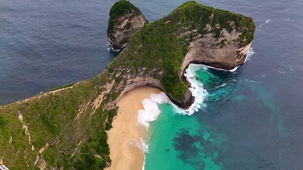 Aerial view of Kelingking Beach cliffs and turquoise sea Indonesia. Aerial view of Kelingking Beach cliffs and turquoise sea Indonesia.