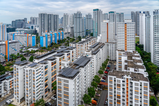 Aerial view of high rise HDB residential apartment blocks in the Whampoa area featuring solar panels on rooftops lush greenery and urban infrastructure in Singapore Singapore. Aerial view of high rise HDB residential apartment blocks in the Whampoa area featuring solar panels on rooftops lush greenery and urban infrastructure in Singapore Singapore.