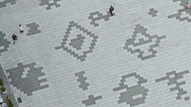 Aerial view of people walking on geometric stone pavement Albania. Aerial view of people walking on geometric stone pavement Albania.
