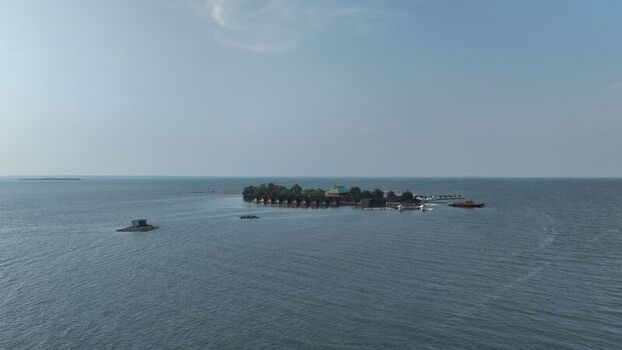 Aerial view of Pulau Lima Resort surrounded by calm blue waters and small boats in Kasemen Banten Indonesia. Aerial view of Pulau Lima Resort surrounded by calm blue waters and small boats in Kasemen Banten Indonesia.