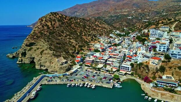 Aerial view of Crete coastal town and harbor Greece.