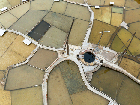 Aerial view of Salinas de Rio Maior featuring the historic salt pans with their characteristic wooden structures and water filled basins in Rio Maior Santarem Portugal. Aerial view of Salinas de Rio Maior featuring the historic salt pans with their characteristic wooden structures and water filled basins in Rio Maior Santarem Portugal.