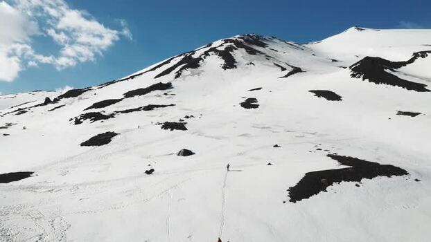 Aerial view of a skier on the snowy slopes of Rifugio Sapienza Italy. Aerial view of a skier on the snowy slopes of Rifugio Sapienza Italy.