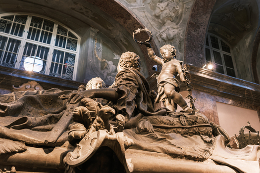 Vienna Austria 25 April 2026 View of the ornate bronze sarcophagus with elaborate sculptures and a cherub holding a crown of stars inside the Imperial Crypt. Vienna Austria 25 April 2026 View of the ornate bronze sarcophagus with elaborate sculptures and a cherub holding a crown of stars inside the Imperial Crypt.