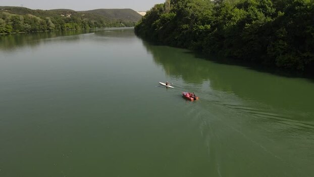 Aerial view of a boat and kayak on the calm river Loire France. Aerial view of a boat and kayak on the calm river Loire France.