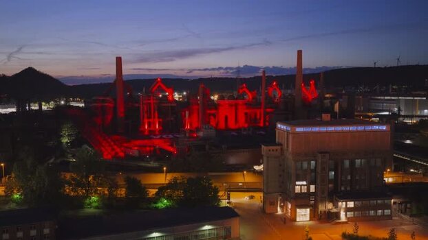 Aerial view of Volklingen Ironworks illuminated at dusk Germany. Aerial view of Volklingen Ironworks illuminated at dusk Germany.
