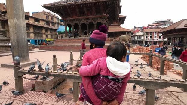 View of Kathmandu Durbar Square with a mother and child Nepal.