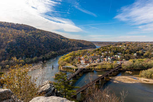 Harpers Ferry West Virginia United States 16 November 2019 Aerial view of the confluence of the Potomac and Shenandoah rivers with historic buildings bridges and autumn foliage. Harpers Ferry West Virginia United States 16 November 2019 Aerial view of the confluence of the Potomac and Shenandoah rivers with historic buildings bridges and autumn foliage.