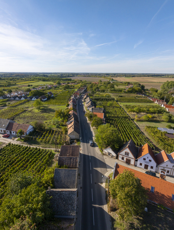 Aerial view of Hajos pincefalu with its traditional wine cellars vineyards and a road winding through the village in Hajos Hungary. Aerial view of Hajos pincefalu with its traditional wine cellars vineyards and a road winding through the village in Hajos Hungary.