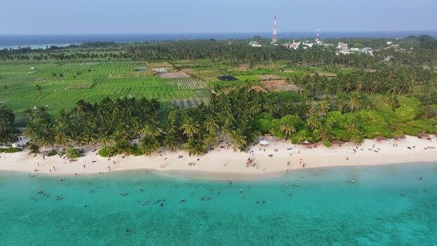 Aerial view of the tropical beach and lush greenery in Thoddoo Maldives. Aerial view of the tropical beach and lush greenery in Thoddoo Maldives.