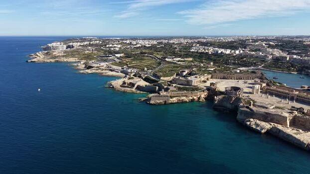 Aerial view of Fort Rinella and the rocky coastline in Malta.