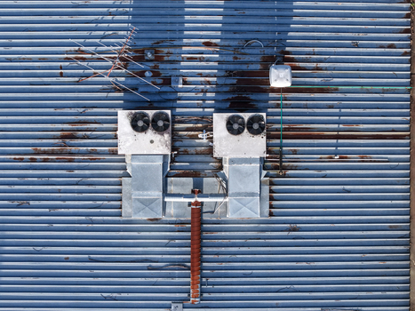 Aerial view of industrial factory roof with HVAC units ventilation systems and antenna in Kilsyth South Melbourne VIC Australia. Aerial view of industrial factory roof with HVAC units ventilation systems and antenna in Kilsyth South Melbourne VIC Australia.