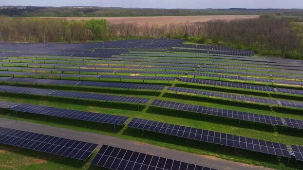 Aerial view of a solar farm with rows of panels in Lebanon United States. Aerial view of a solar farm with rows of panels in Lebanon United States.