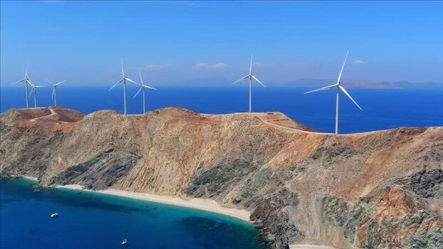 Aerial view of wind turbines on a rocky ridge in Greece. Aerial view of wind turbines on a rocky ridge in Greece.