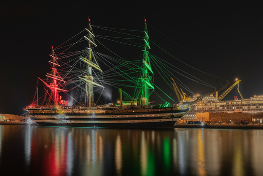 Ancona Italy 12 October 2022 View of the Amerigo Vespucci training ship illuminated with the colors of the Italian flag at night in the port of Ancona.