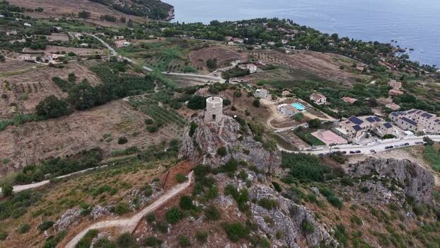 Aerial view of Torre di Scopello watchtower in Scopello Italy.
