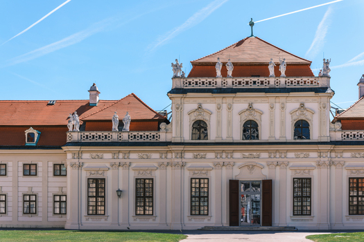View of the baroque facade and statues of the Belvedere Palace under a clear blue sky in Vienna Vienna Austria. View of the baroque facade and statues of the Belvedere Palace under a clear blue sky in Vienna Vienna Austria.