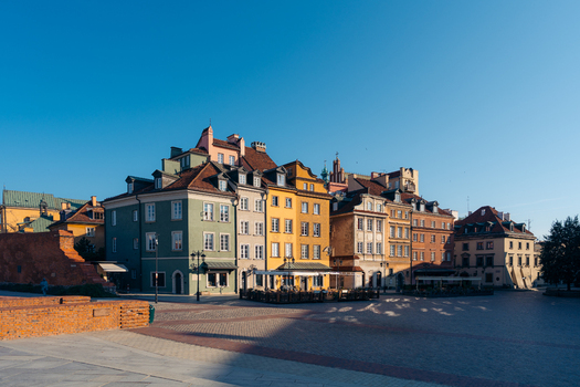 View of Warsaw Old Town with its colorful historic buildings cobblestone square and clear blue sky in Warsaw Masovian Voivodeship Poland. View of Warsaw Old Town with its colorful historic buildings cobblestone square and clear blue sky in Warsaw Masovian Voivodeship Poland.