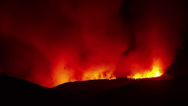 View of forest fire at night in Spain.