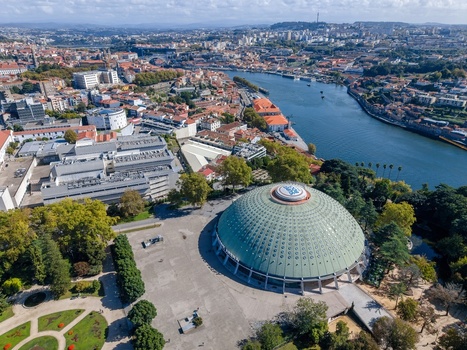 Aerial view of the Super Bock Arena dome situated within the lush Jardins do Palacio de Cristal overlooking the Douro River and the historic cityscape of Porto Porto Portugal.