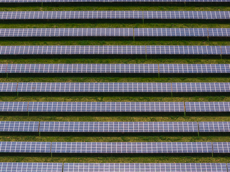Aerial view of rows of solar panels arranged in a geometric pattern on a green field Sivice South Moravian Region Czechia.