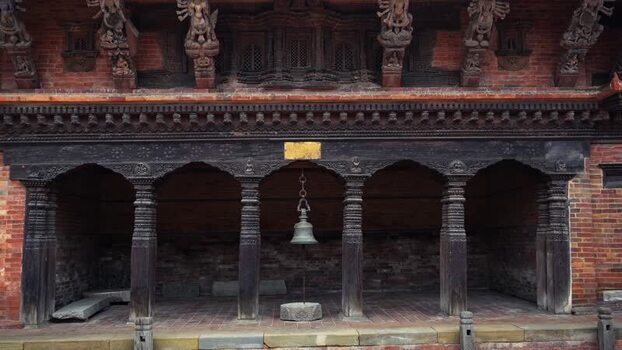 View of traditional carved wooden temple architecture Nepal.