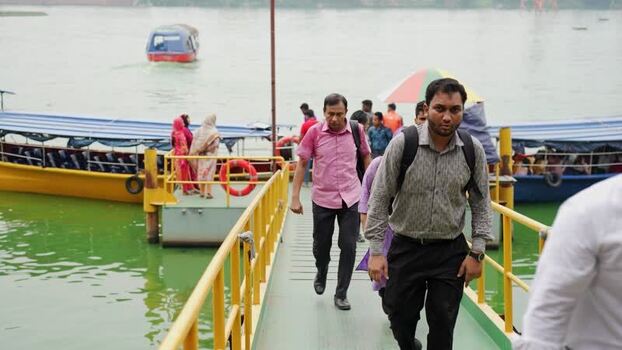 View of people walking on a pier from a boat in Dhaka Bangladesh.