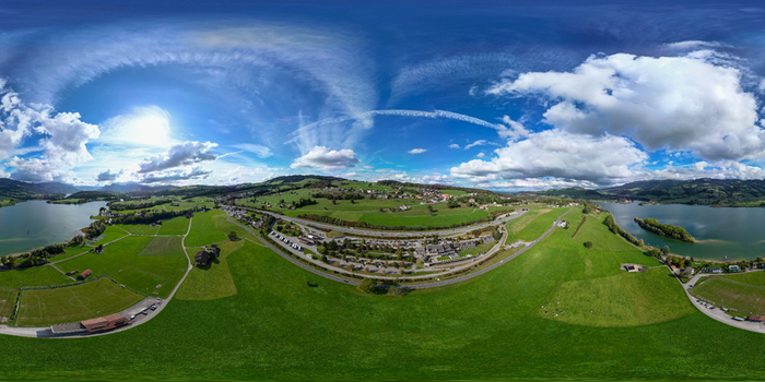 Aerial view of spherical panorama of Station Restoroute Motel De La Gruyere overlooking Lake Gruyere with green pastures and a highway Pont en Ogoz Fribourg Switzerland. Aerial view of spherical panorama of Station Restoroute Motel De La Gruyere overlooking Lake Gruyere with green pastures and a highway Pont en Ogoz Fribourg Switzerland.