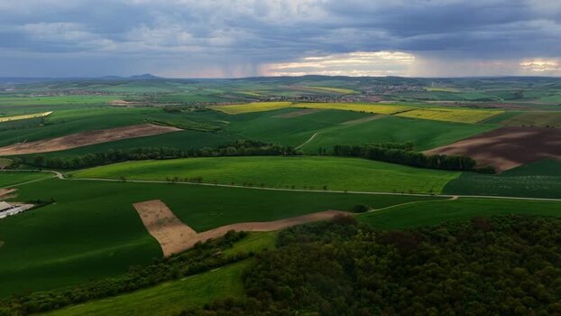 Aerial view of rolling green hills and fields in Czechia.