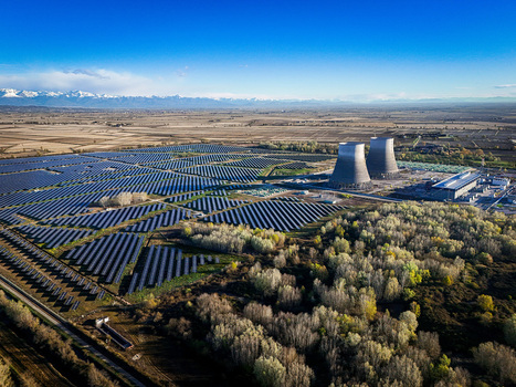 Trino Italy 30 March 2026 Aerial view of solar panels contrast with the towering cooling towers against a backdrop of distant snow capped mountains. Trino Italy 30 March 2026 Aerial view of solar panels contrast with the towering cooling towers against a backdrop of distant snow capped mountains.