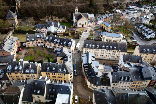 Aerial view of the historic Grund district with its dense urban architecture winding streets and traditional buildings nestled in the valley Luxembourg Luxembourg Luxembourg.