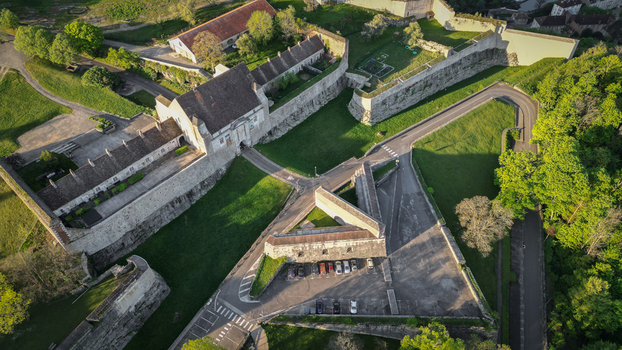 Aerial view of Besancon Citadel with its massive stone fortifications historic buildings and lush greenery in Besancon Bourgogne Franche Comte France. Aerial view of Besancon Citadel with its massive stone fortifications historic buildings and lush greenery in Besancon Bourgogne Franche Comte France.